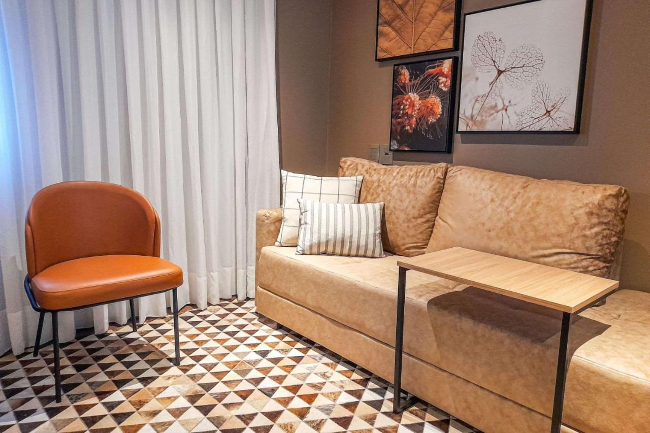 Art Hotel Transamerica Collection Порту Алегри Екстериор снимка A living room in a suite at the hotel